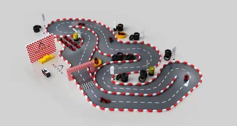 Model of a winding kart track with kerbs and start gantry